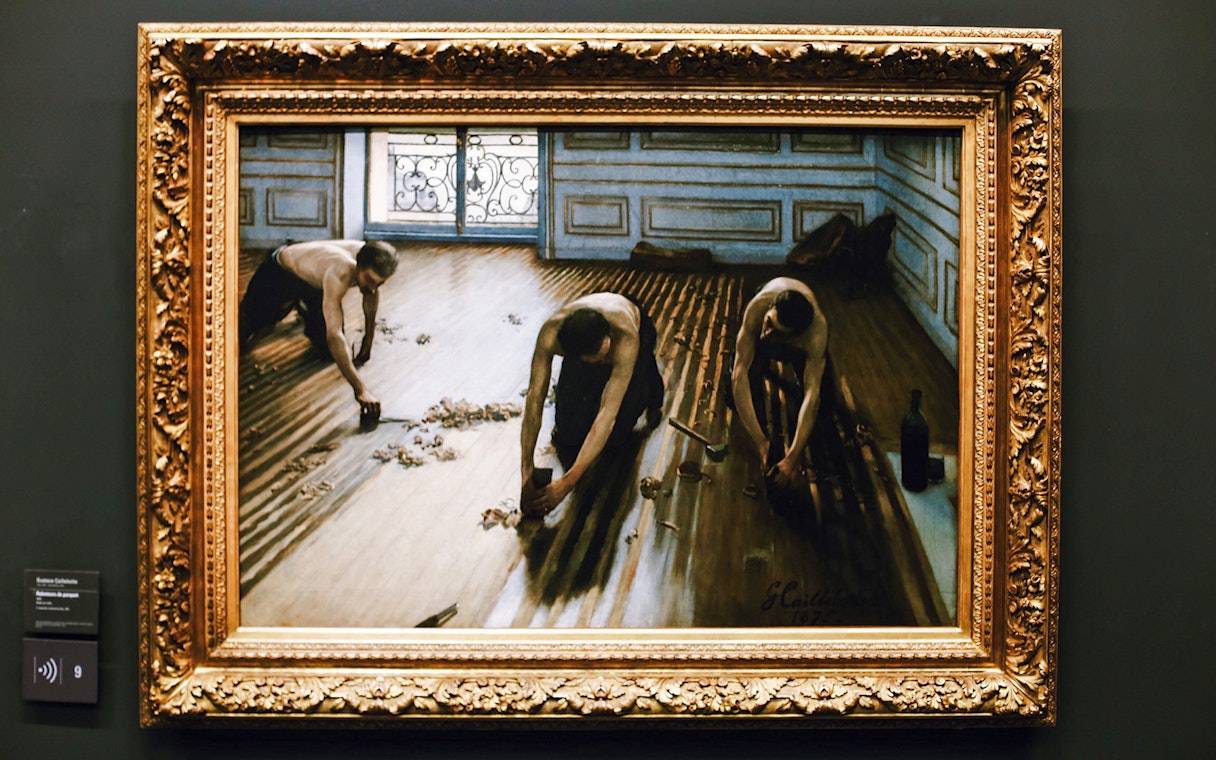 Painting of workers scraping a wooden floor, displayed in Orsay Museum, Paris, France.
