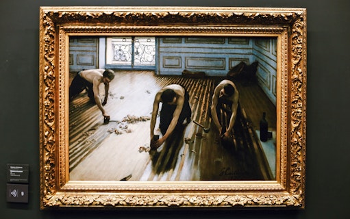 Painting of workers scraping a wooden floor, displayed in Orsay Museum, Paris, France.