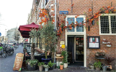 Street view of a cozy café with outdoor seating on Zijlstraat, Haarlem.
