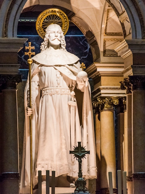 Statue at the altar of St. Stephen's Basilica, Budapest, with ornate columns.