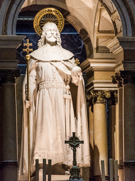 Statue at the altar of St. Stephen's Basilica, Budapest, with ornate columns.