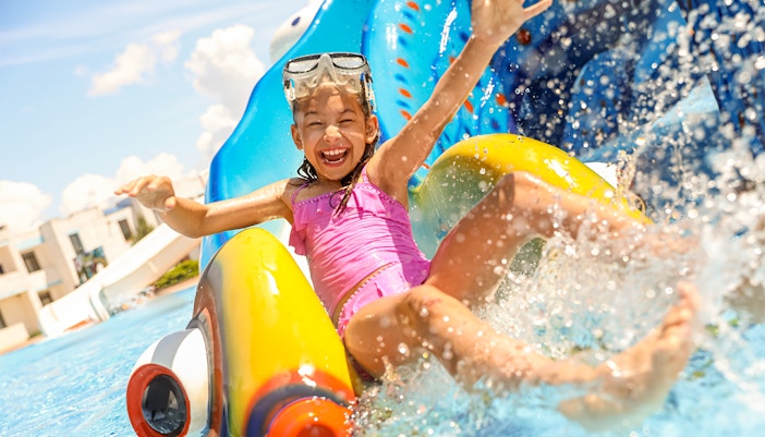 Visitors enjoying water slides at Yas Waterworld Abu Dhabi Rides.