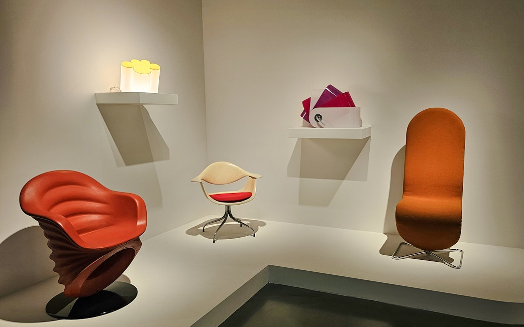 Centre Pompidou Malaga exhibition interior with modern chairs and art displays.