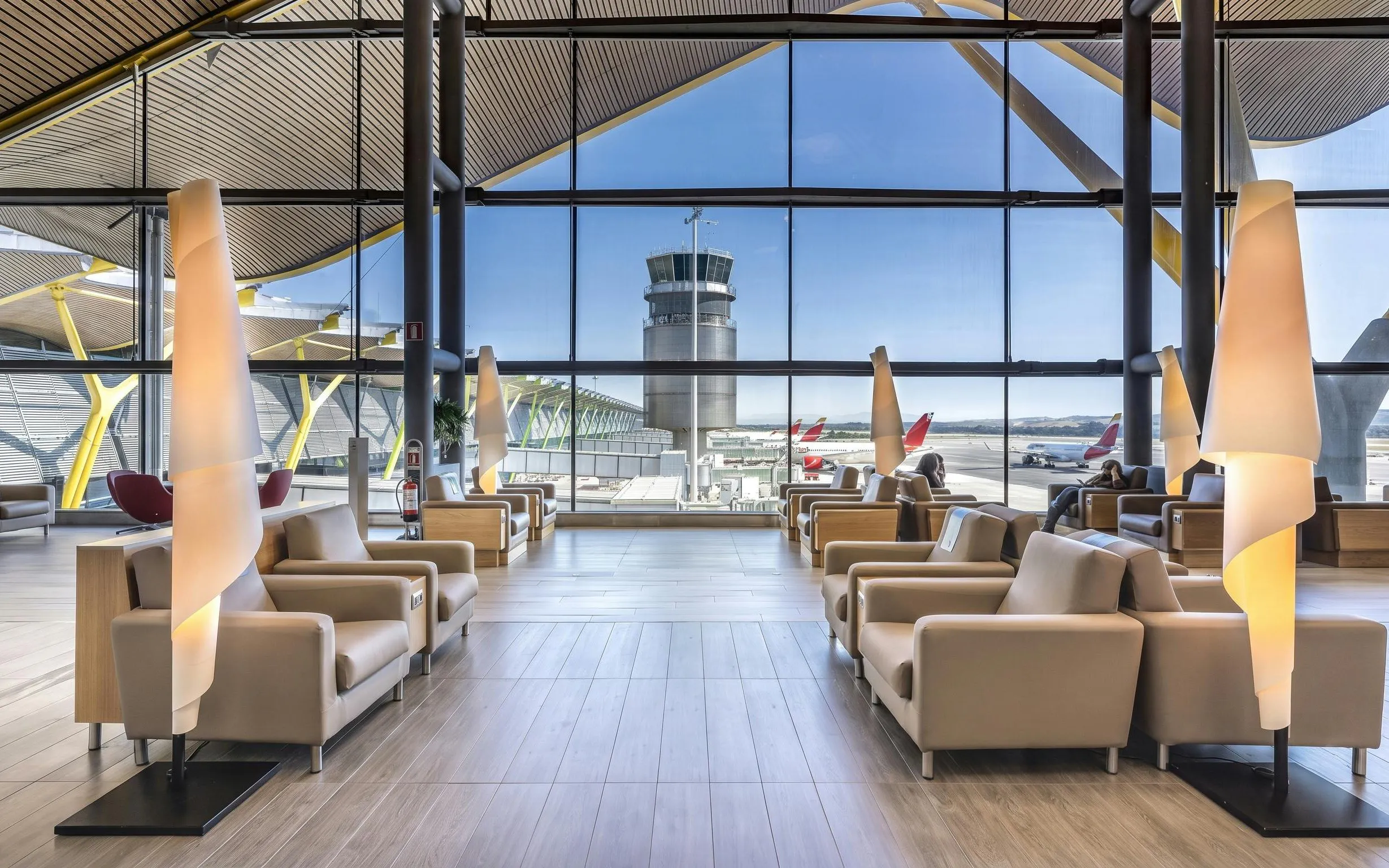 Sala VIP Neptuno lounge seating area with airport view, Adolfo Suarez-Barajas Airport, Madrid.