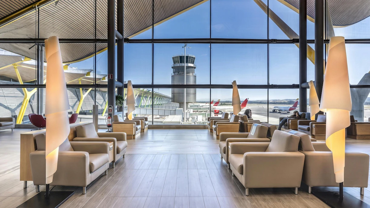 Sala VIP Neptuno lounge seating area with airport view, Adolfo Suarez-Barajas Airport, Madrid.