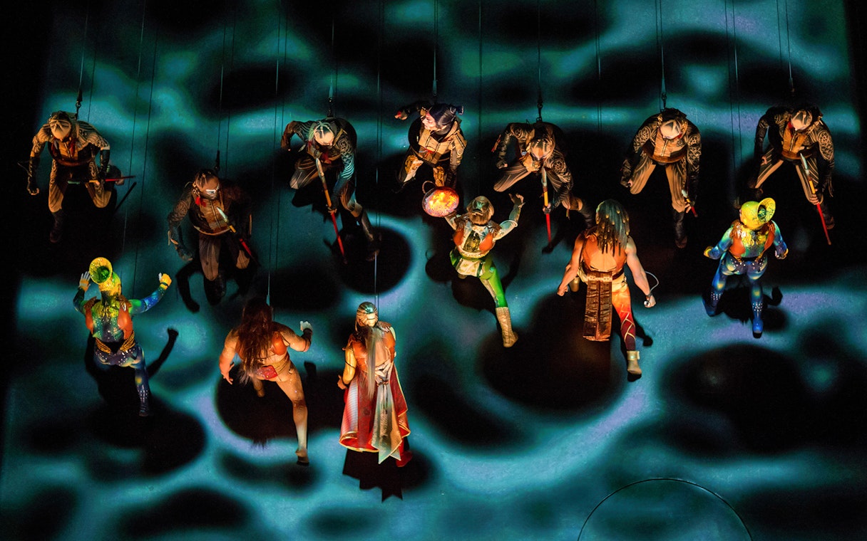 Performers suspended in mid-air during Cirque du Soleil KÀ show.