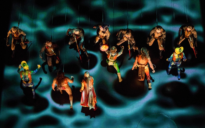 Performers suspended in mid-air during Cirque du Soleil KÀ show.