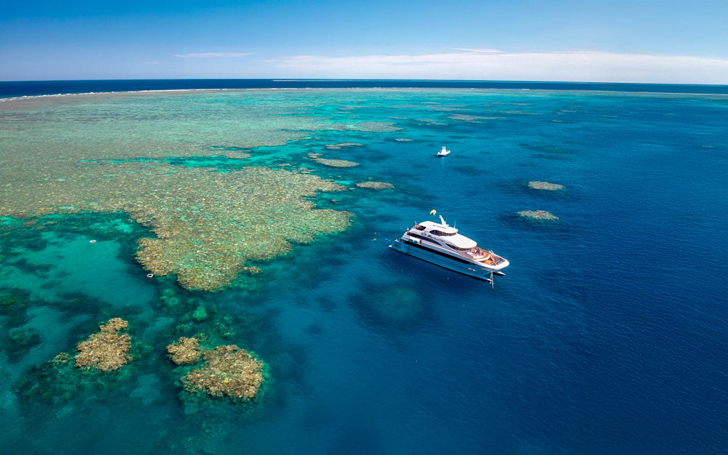 Cruise ship near coral reefs on Great Barrier Reef, Cairns.