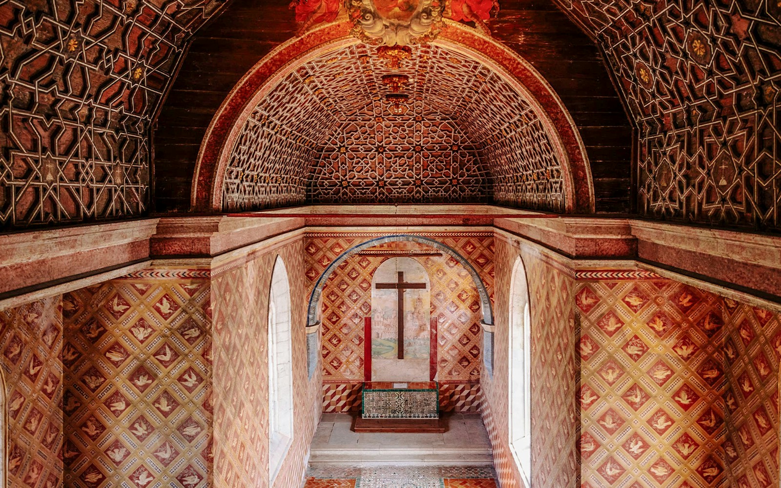 Sintra National Palace Chapel interior with ornate ceiling and historical architecture.