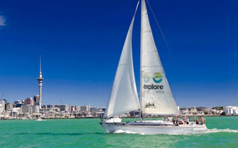 Sailing cruise on Waitematā Harbour with Auckland skyline in the background.