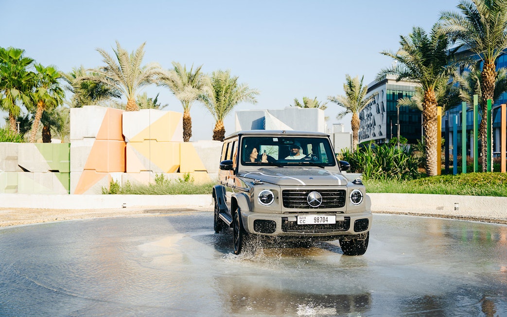 Mercedes-Benz driving through water in Dubai off-road experience.