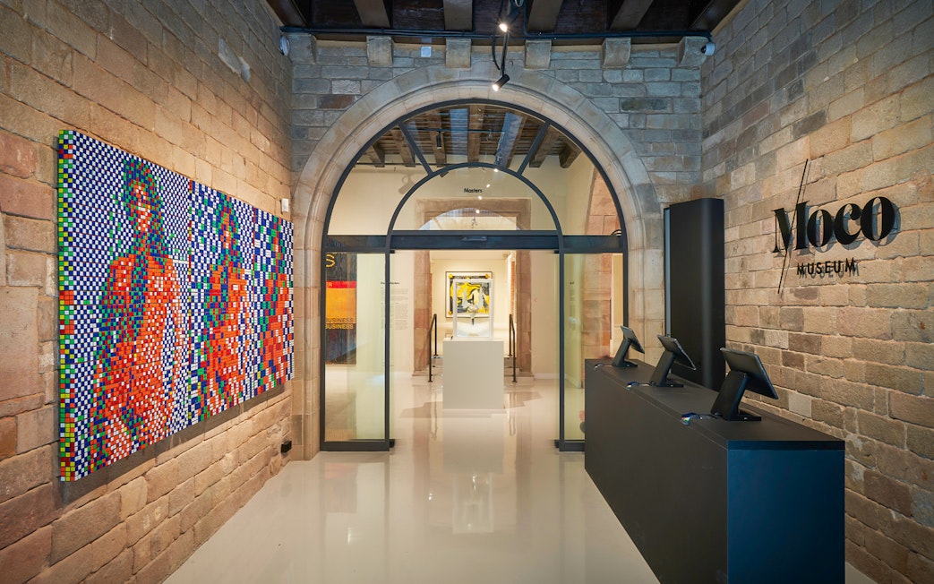 Moco Museum entrance in Barcelona with colorful modern art display.