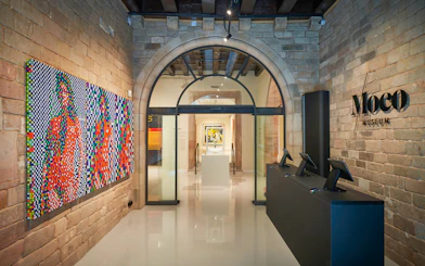 Moco Museum entrance in Barcelona with colorful modern art display.