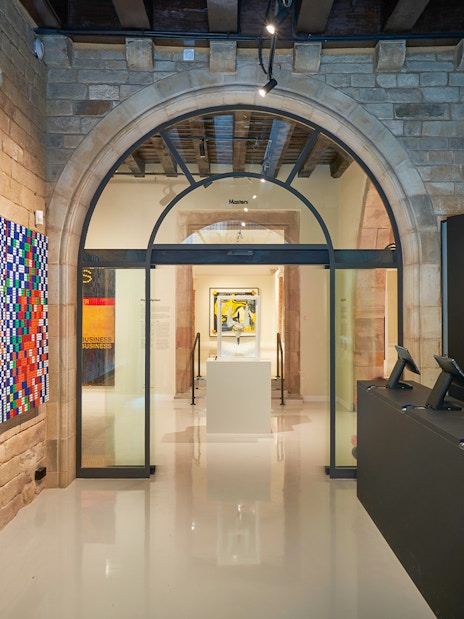 Moco Museum entrance in Barcelona with colorful modern art display.
