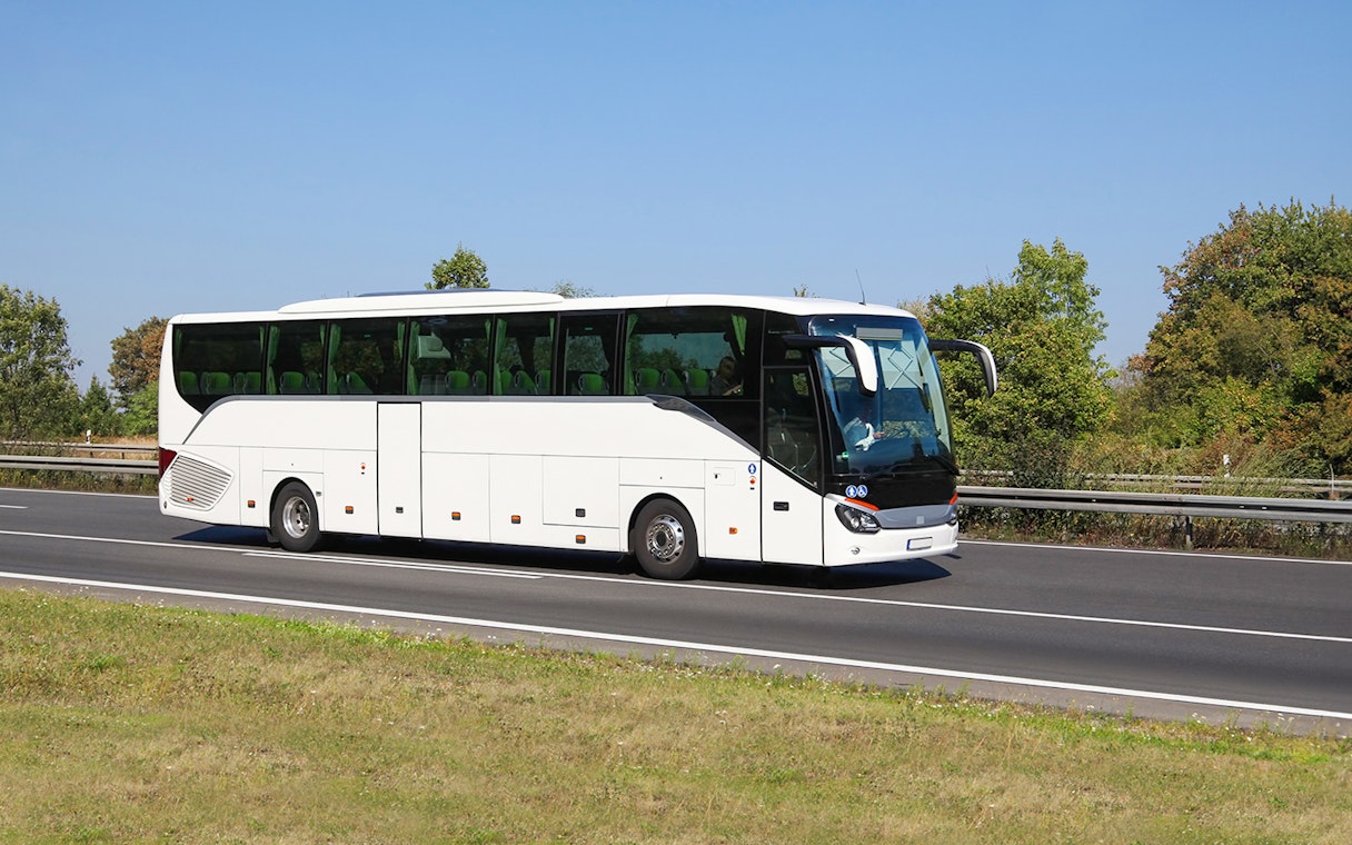 Tour bus on highway for Amsterdam to Zaanse Schans, Edam, Volendam, Marken tour.