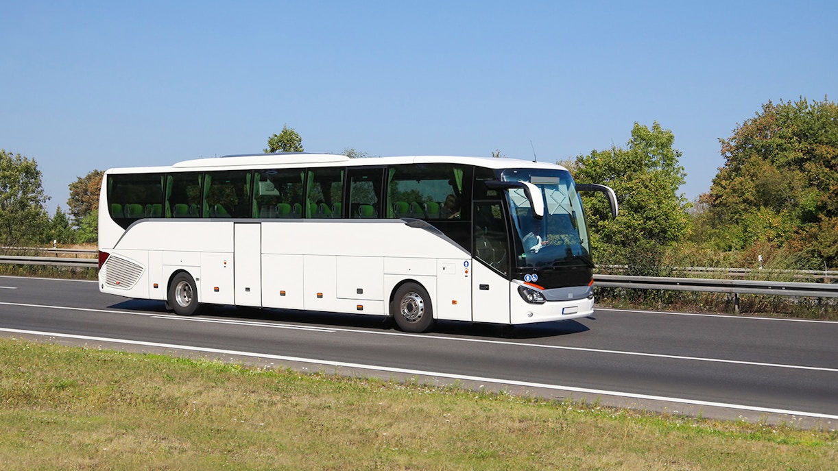 Tour bus on highway for Amsterdam to Zaanse Schans, Edam, Volendam, Marken tour.
