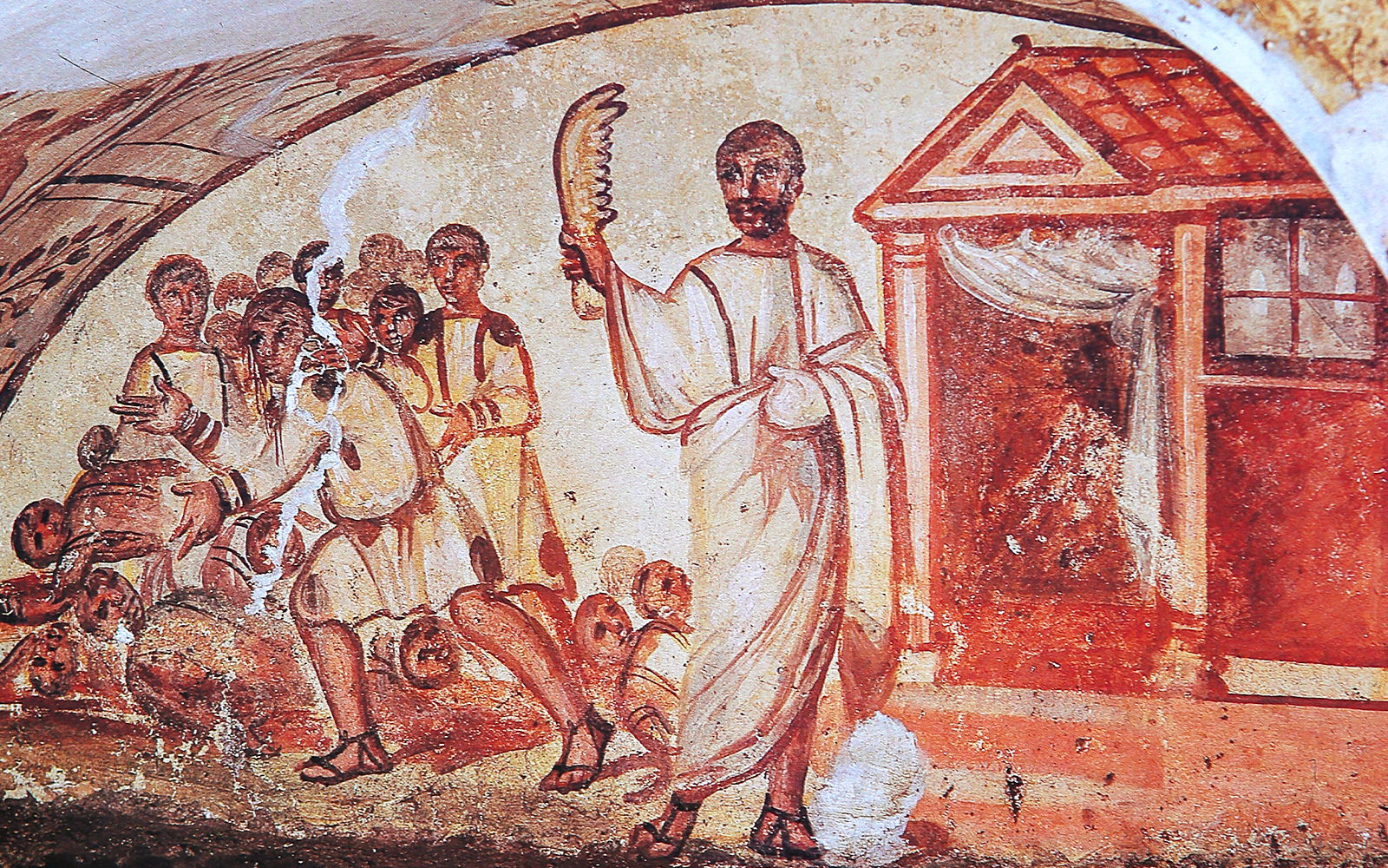 Ancient fresco depicting figures in Roman attire inside catacombs on the Appian Way, Rome.