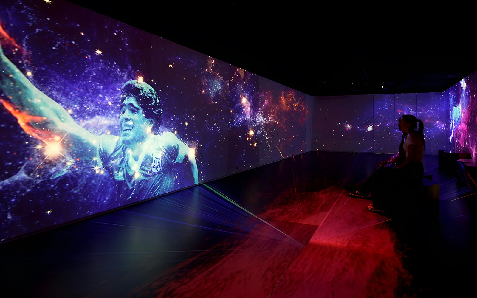 Football legends artwork display in Madrid gallery.