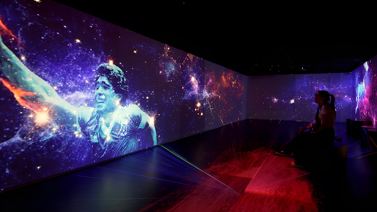 Football legends artwork display in Madrid gallery.