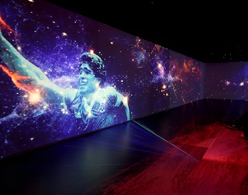 Football legends artwork display in Madrid gallery.