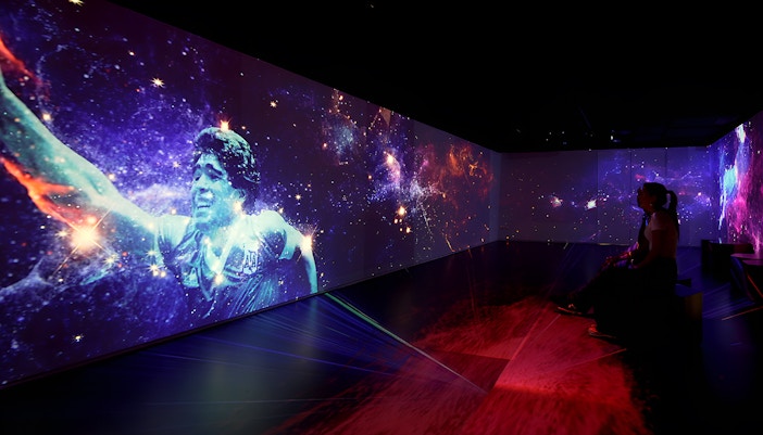 Football legends artwork display in Madrid gallery.