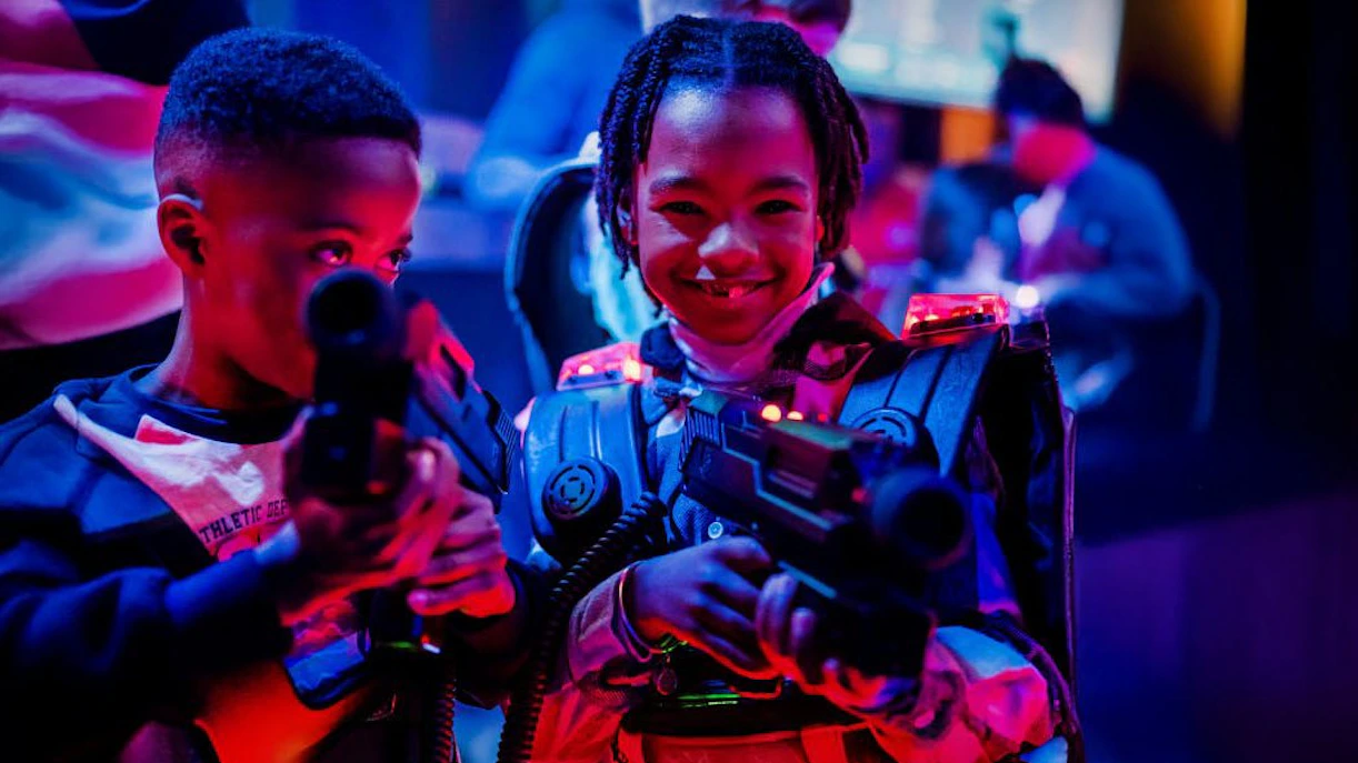Children playing laser tag at Lasergame Rotterdam.