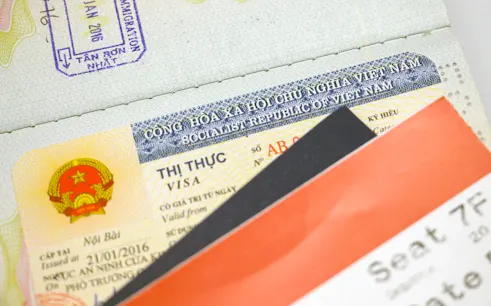 Vietnam visa with passport and boarding pass for expedited e-visa service, Hanoi.