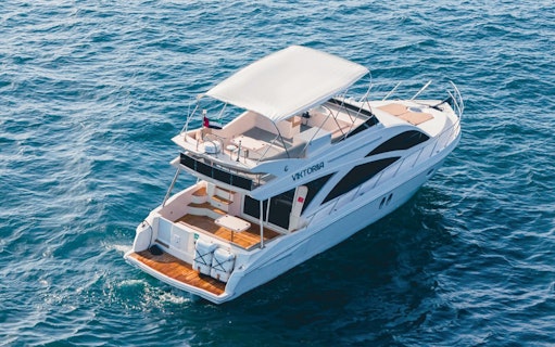 Private luxury yacht sailing in Dubai waters, 46 ft vessel.