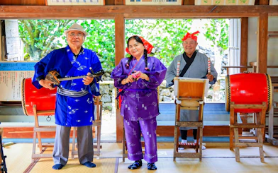Traditional musicians performing at Ishigaki Yaima Village, Japan.