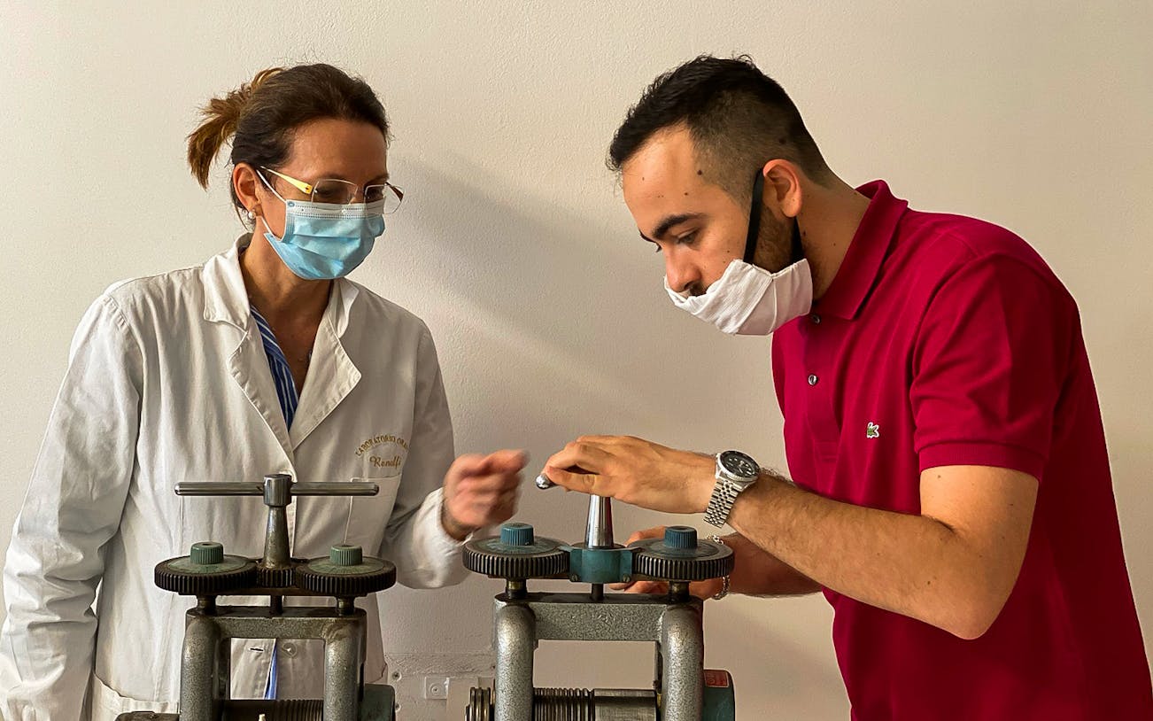 Jewelry-making demonstration at Sardinian workshop in Oristano.