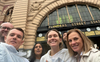 Group at Flinders Street Station entrance, Melbourne, for self-guided city exploration game.