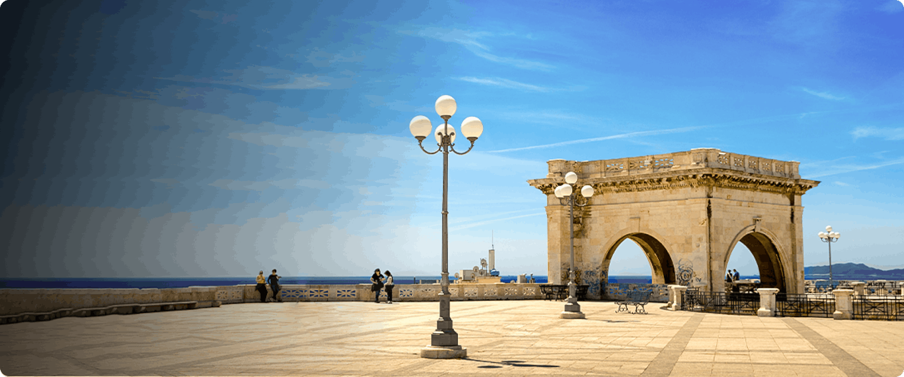 Bastione di Saint Remy terrace with arches and sea view in Cagliari, Italy.