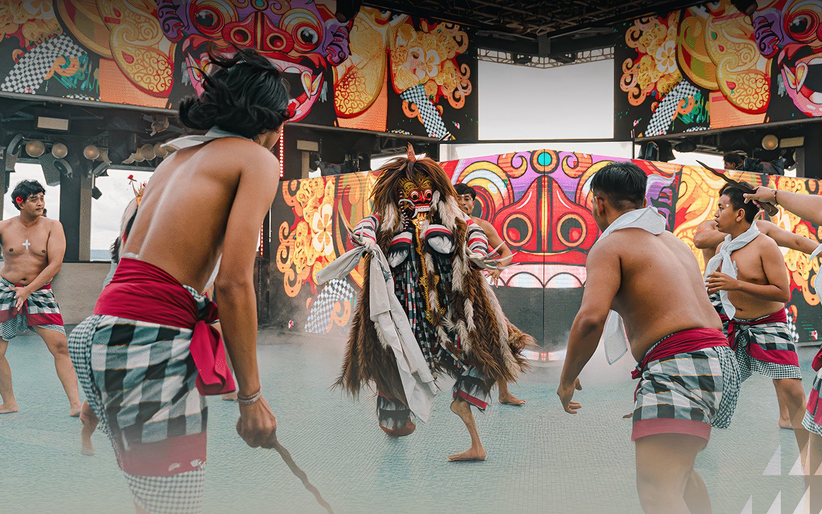 Traditional dance performance at Atlas Beach Club with vibrant costumes and masks.