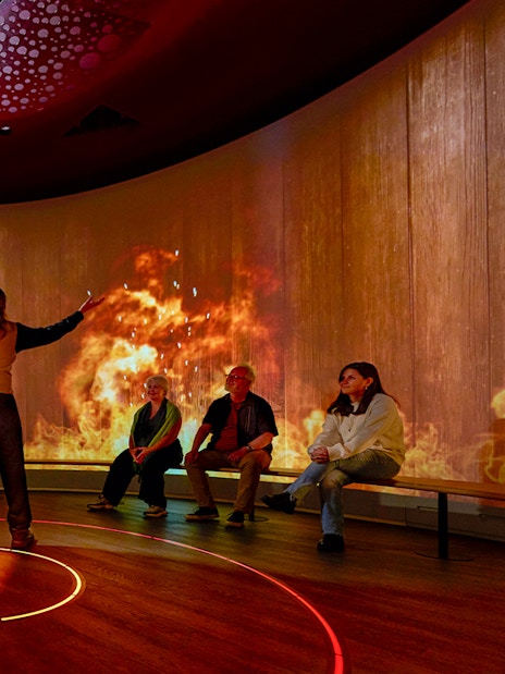 Interactive sensory experience with fiery visuals in a Scottish exhibit.