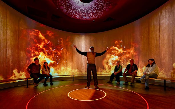Interactive sensory experience with fiery visuals in a Scottish exhibit.