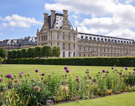 Louvre Museum glass pyramid entrance in Paris, France.