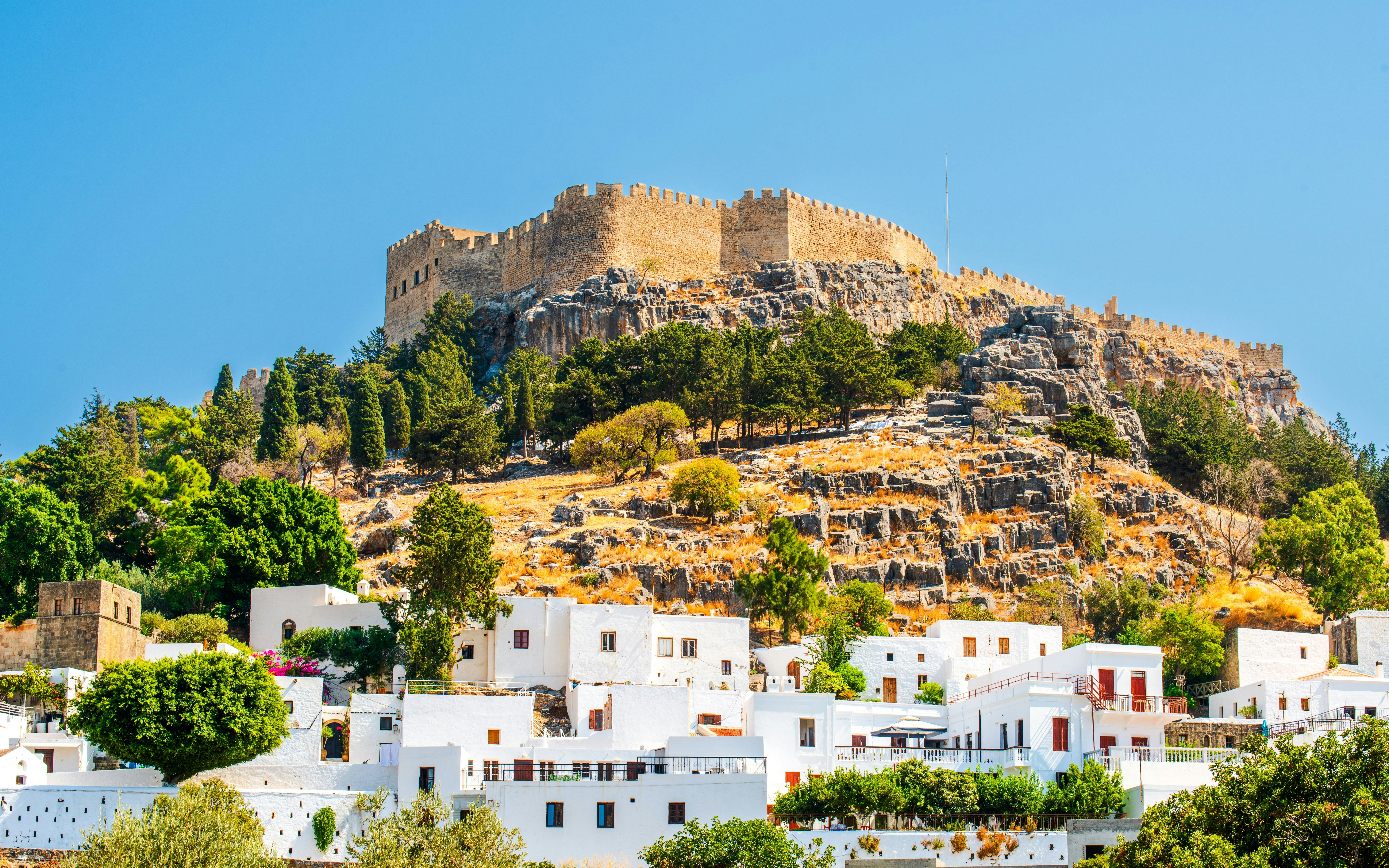 Traditional Greek village beneath the Acropolis of Lindos, Rhodes, Greece.