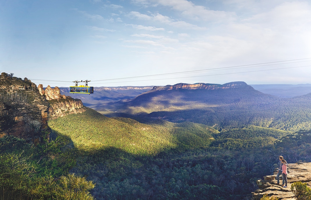 Cableway at Scenic World, Blue Mountains with passengers above forested landscape.