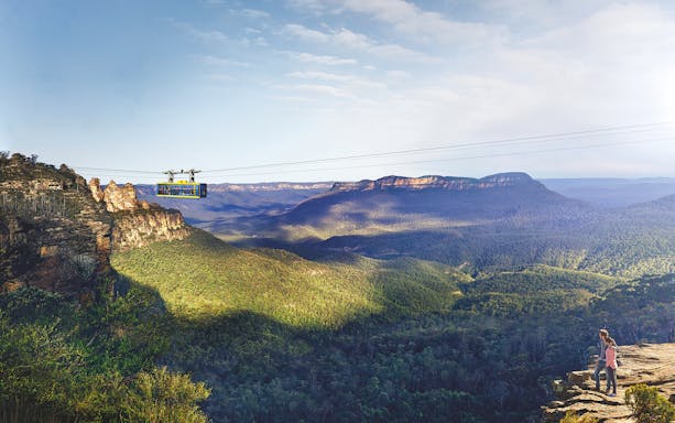 Cableway at Scenic World, Blue Mountains with passengers above forested landscape.