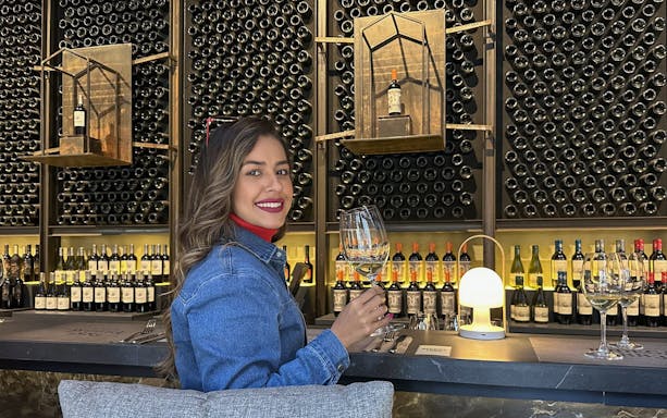 Tourist enjoying wine tasting at Marqués de Casa Concha, Concha y Toro winery.