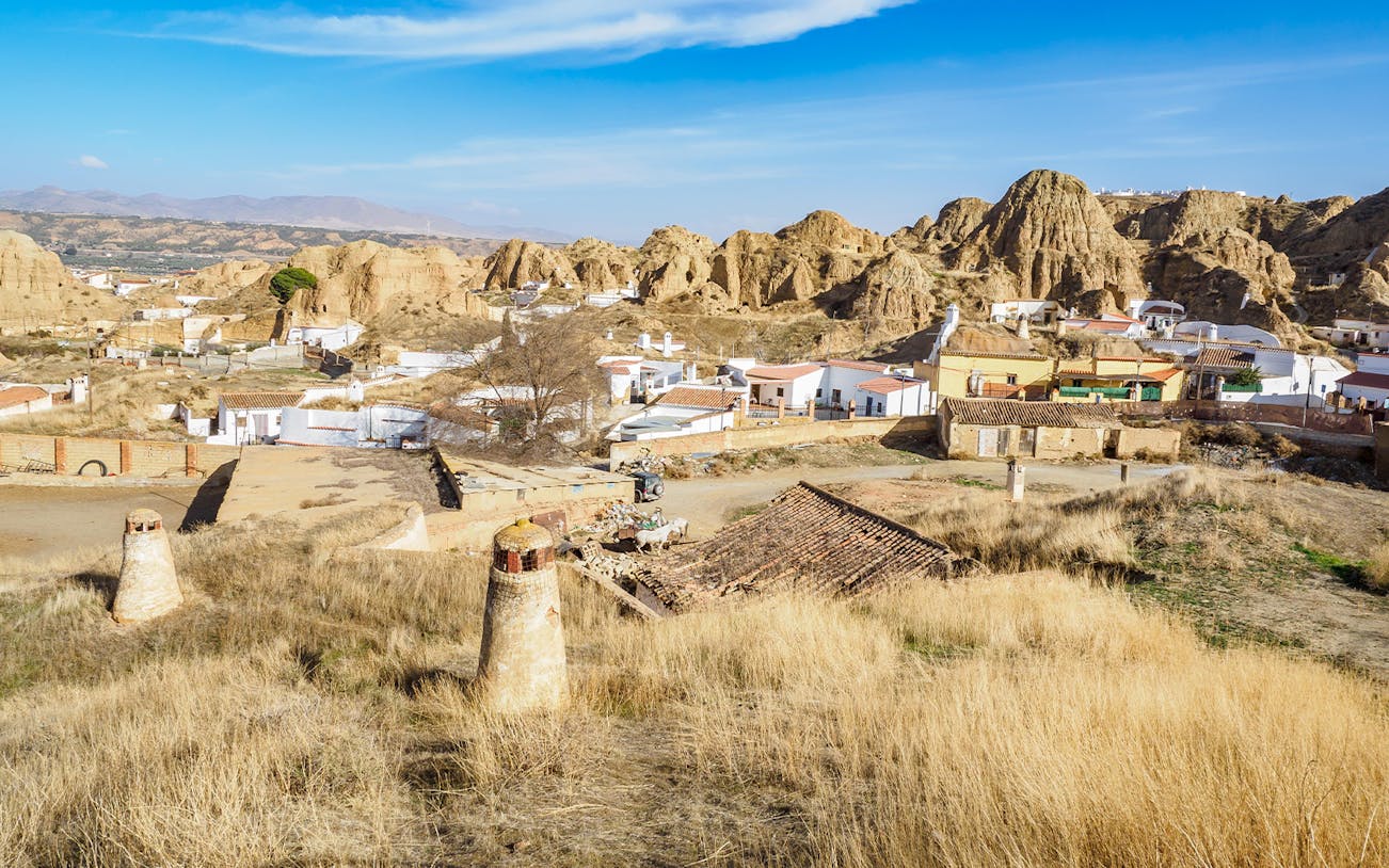 Guadix cave houses and arid landscape in the Tabernas Desert near Granada.