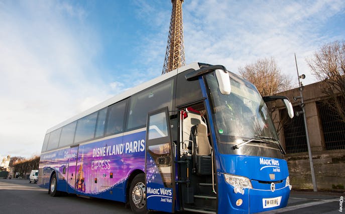 Disneyland Paris shuttle bus near Eiffel Tower in Paris.
