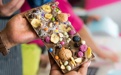 Chocolate bar with assorted toppings at Vienna chocolate workshop.