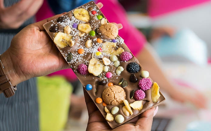 Chocolate bar with assorted toppings at Vienna chocolate workshop.