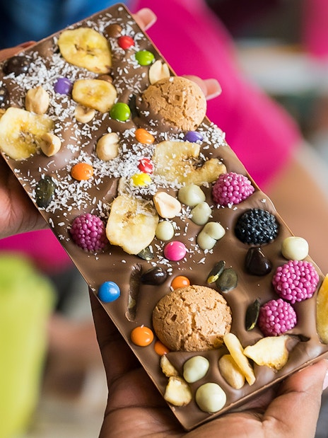 Chocolate bar with assorted toppings at Vienna chocolate workshop.