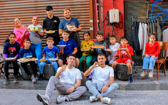 Group enjoying traditional dishes on an Istanbul food tour.