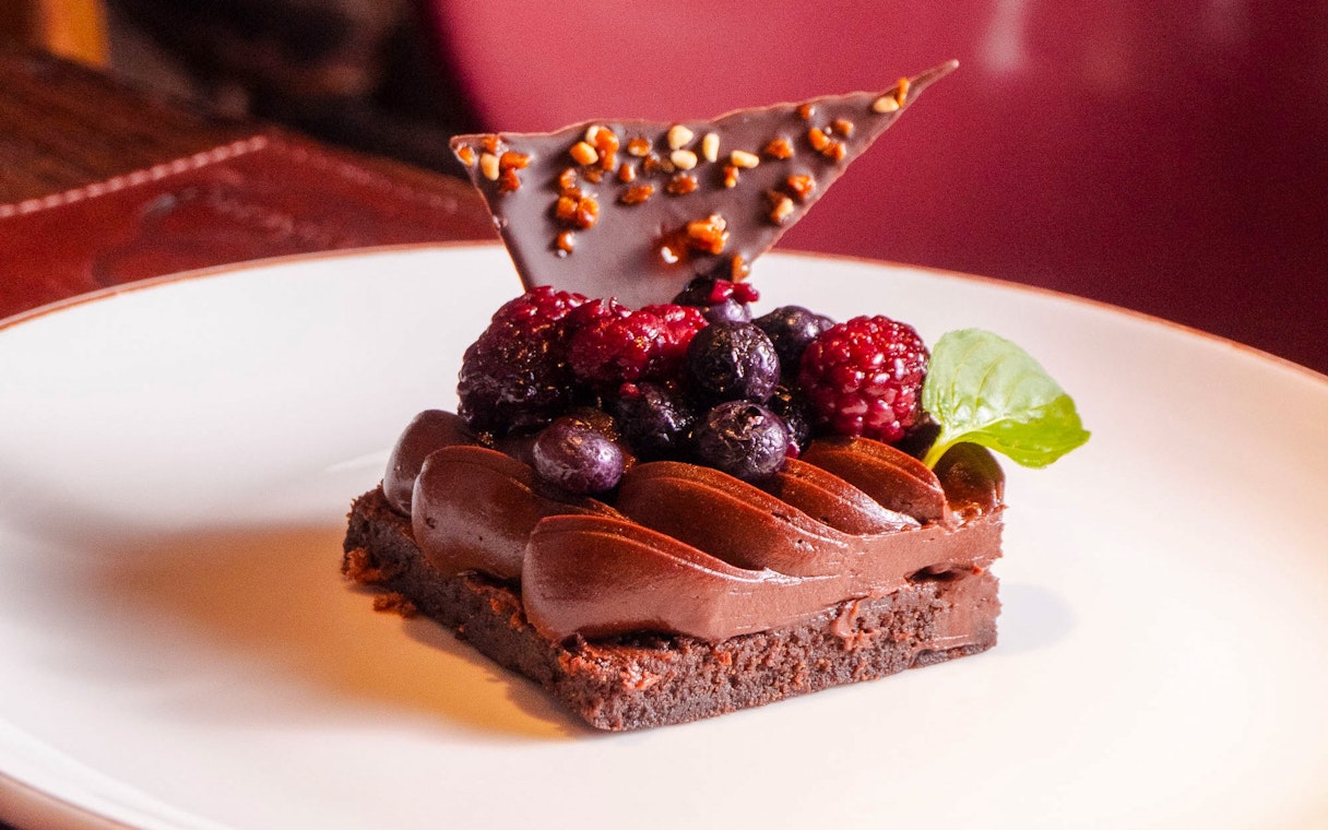 Tartlet with fresh berries and chocolate shard at Michelangelo Tango Show.