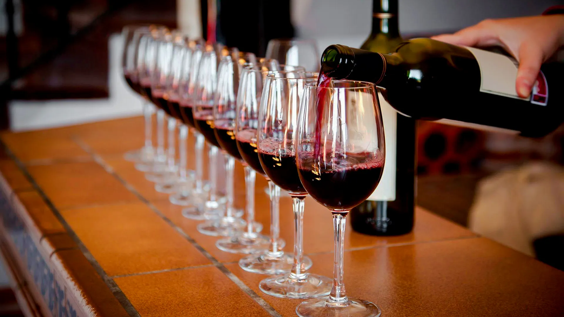 Wine being poured into glasses for a tasting in Rio de Janeiro.