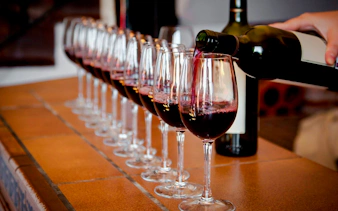 Wine being poured into glasses for a tasting in Rio de Janeiro.
