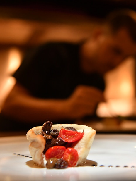 Gourmet dish preparation on Galleon Dinner Cruise in Venice.